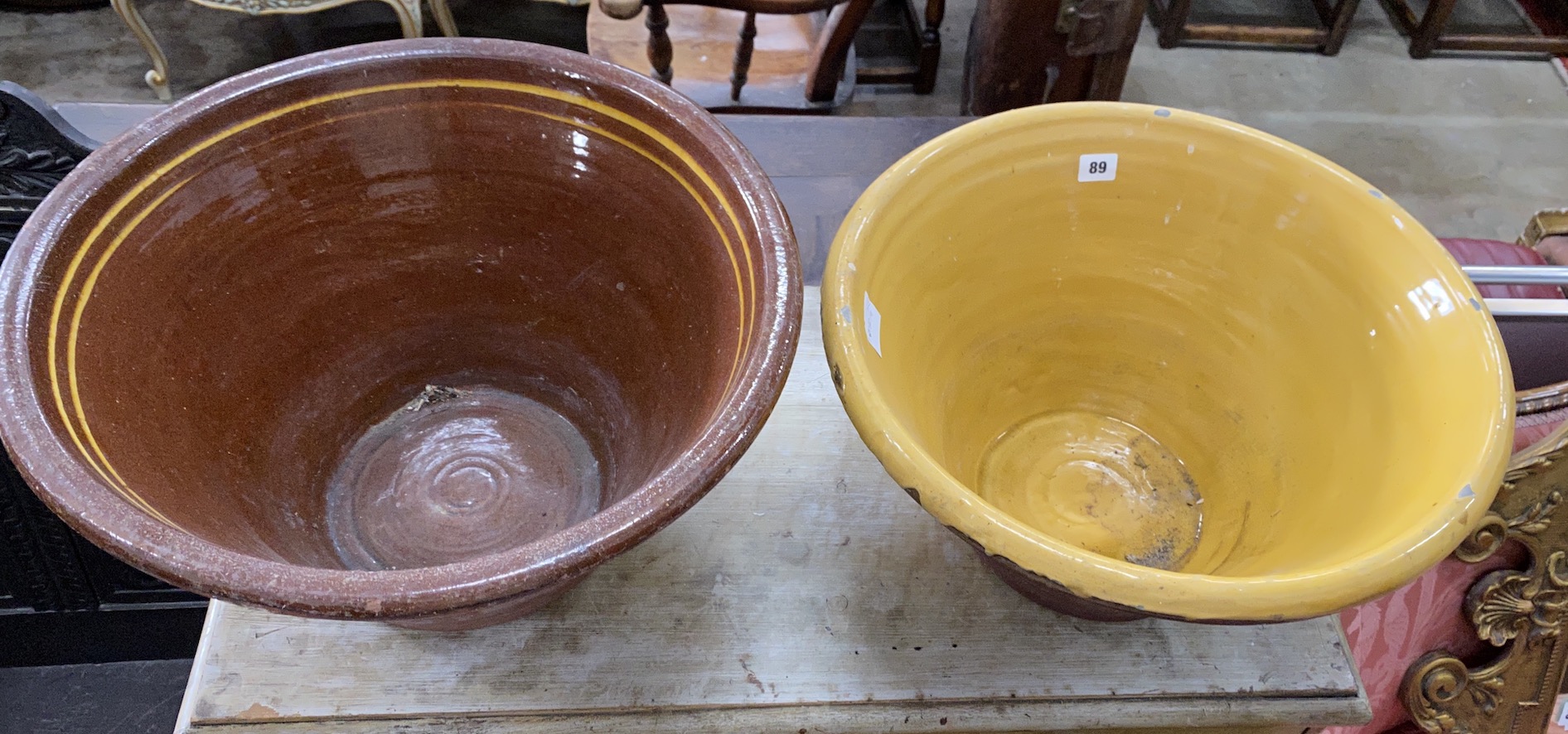 Two Victorian glazed earthenware circular dairy bowls, larger diameter 50cm, height 27cm